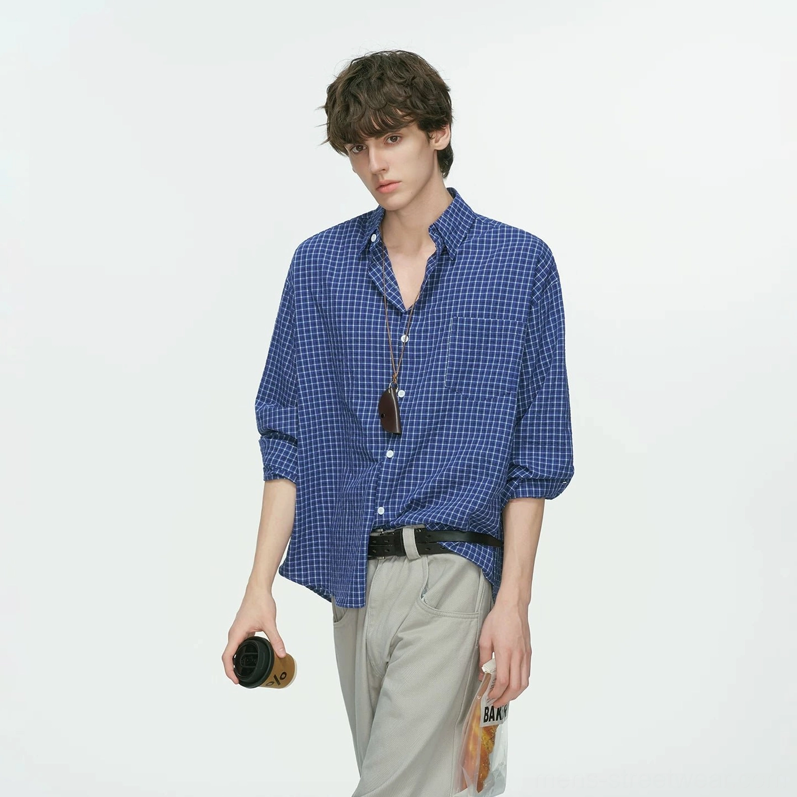 Urban relaxed fit grid shirt inspired by Korean fashion with smooth woven texture, neat collar, and versatile three-season wear