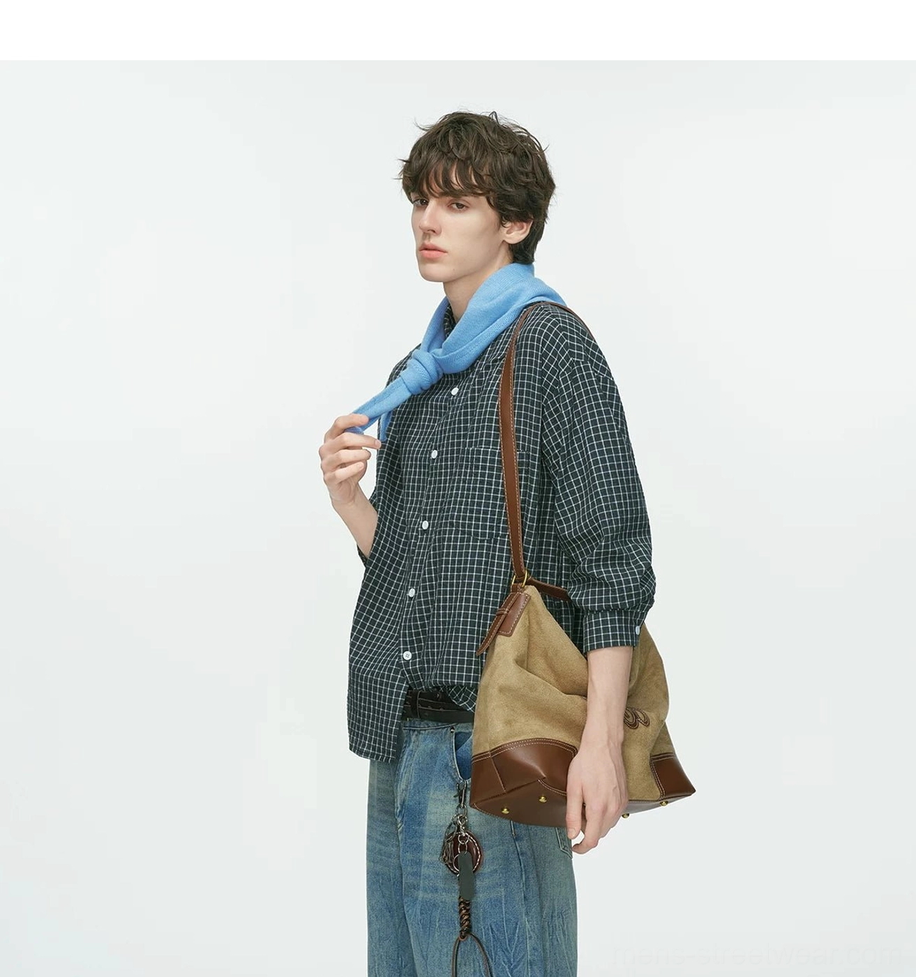 Casual Korean streetwear long-sleeve shirt with subtle plaid texture, extended hem, loose silhouette, and layering potential