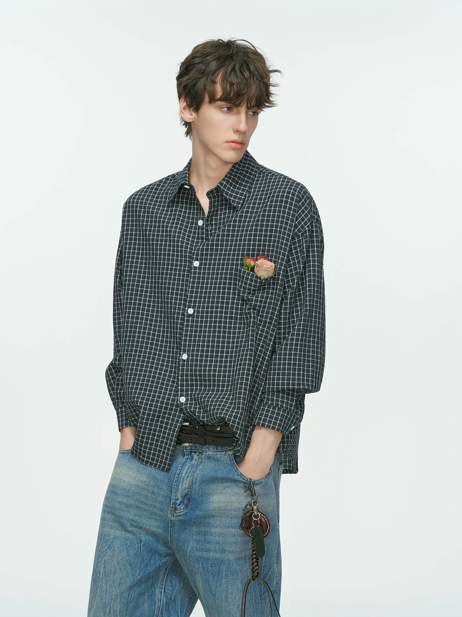 Dark navy relaxed fit grid plaid shirt with white pattern and decorative floral brooch on the chest in modern streetwear styling