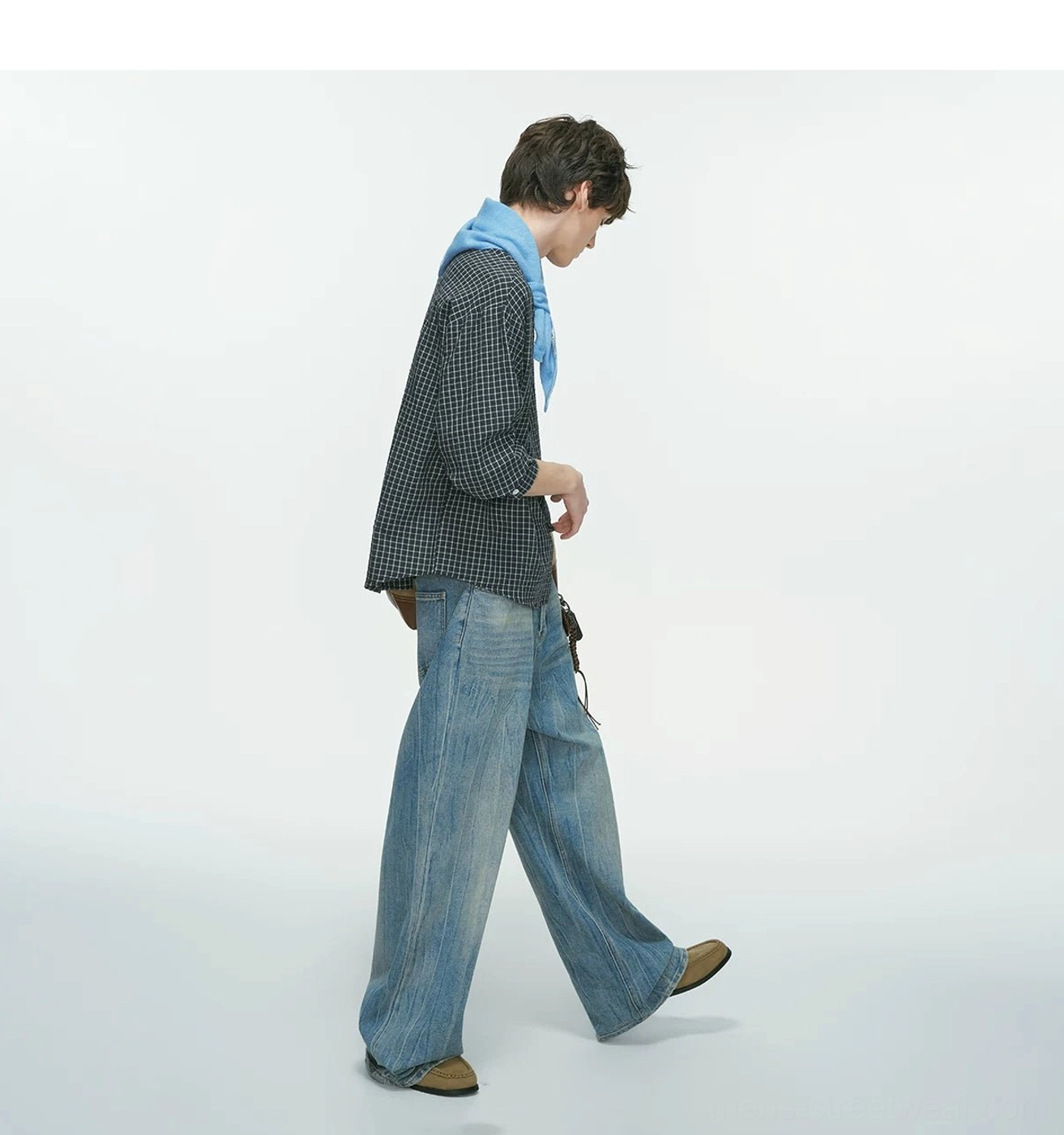 Minimalist men's grid plaid overshirt with clean button placket, relaxed shoulders, and modern urban streetwear character