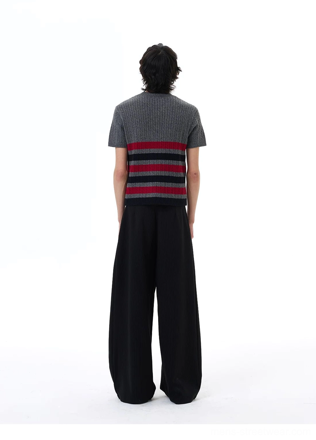 Rear full-body view showing the red and black horizontal stripe pattern continuing across the back of the grey knit tee