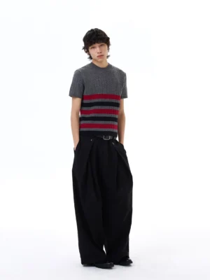 Front view of a cropped grey ribbed knit crew neck tee with graphic red and black stripes in Korean streetwear style
