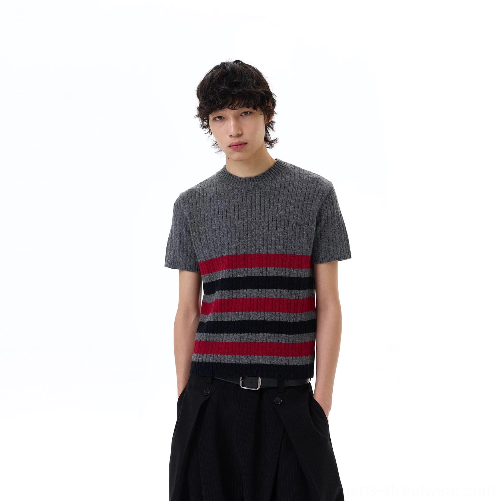 Front full-body outfit view of the grey Metro stripe ribbed knit tee styled with black wide-leg pants and a leather belt