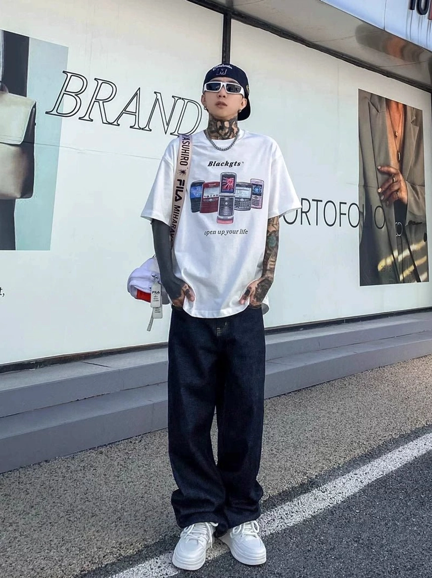 Midnight fade dark indigo relaxed straight leg jeans styled with graphic tee bucket hat and sunglasses
