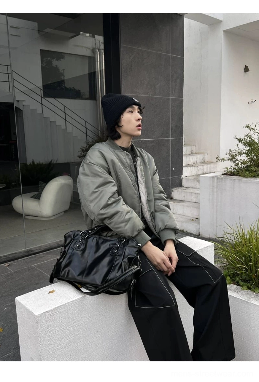 Midnight rivet glossy black faux leather shoulder tote bag in minimalist urban streetwear styling
