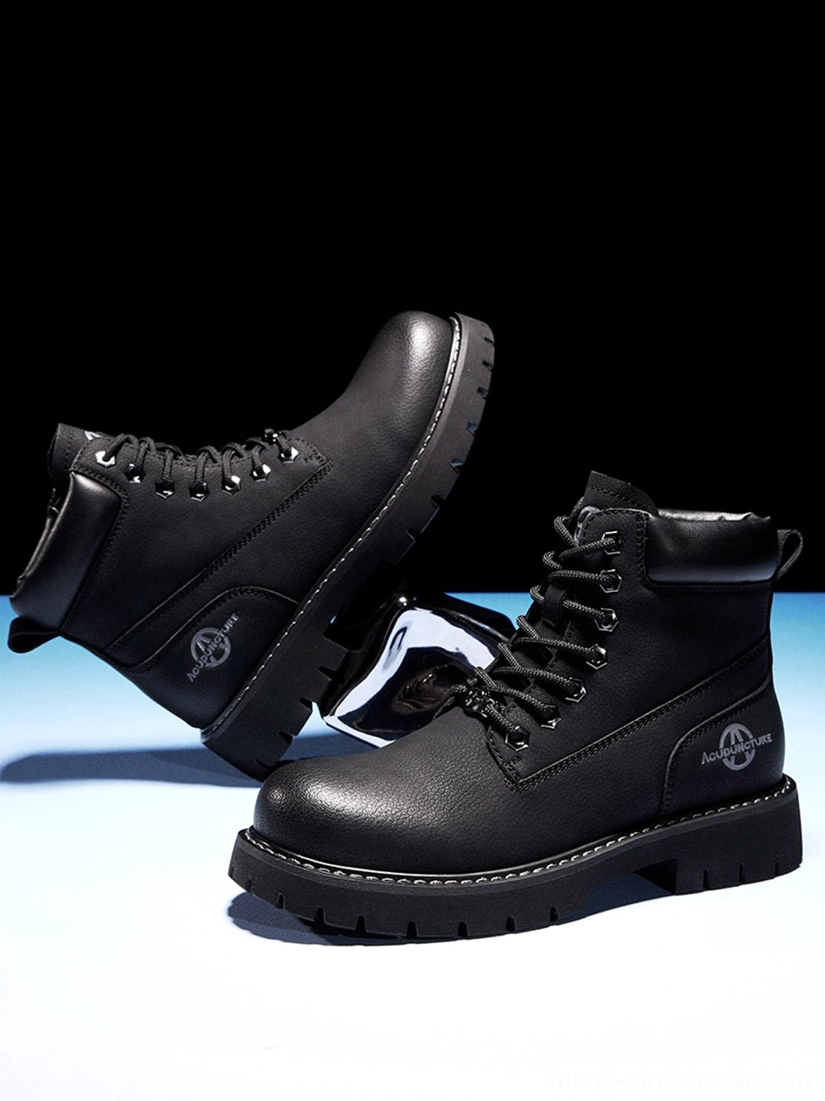 Minimal black zip-front work boots with mid-ankle fit and heavy-duty inspired rubber sole