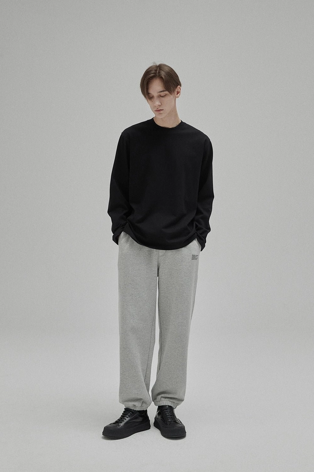 Minimal cotton crew neck T-shirt styled as a refined base layer for seasonal streetwear outfits