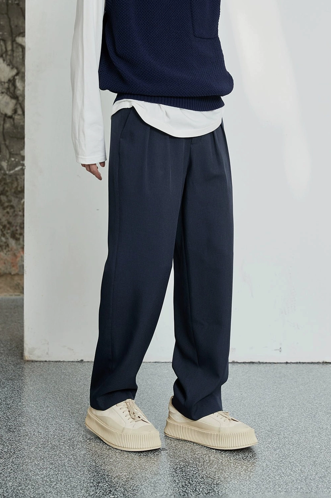 Minimal wide-leg dress pants with refined double pleats for contemporary menswear
