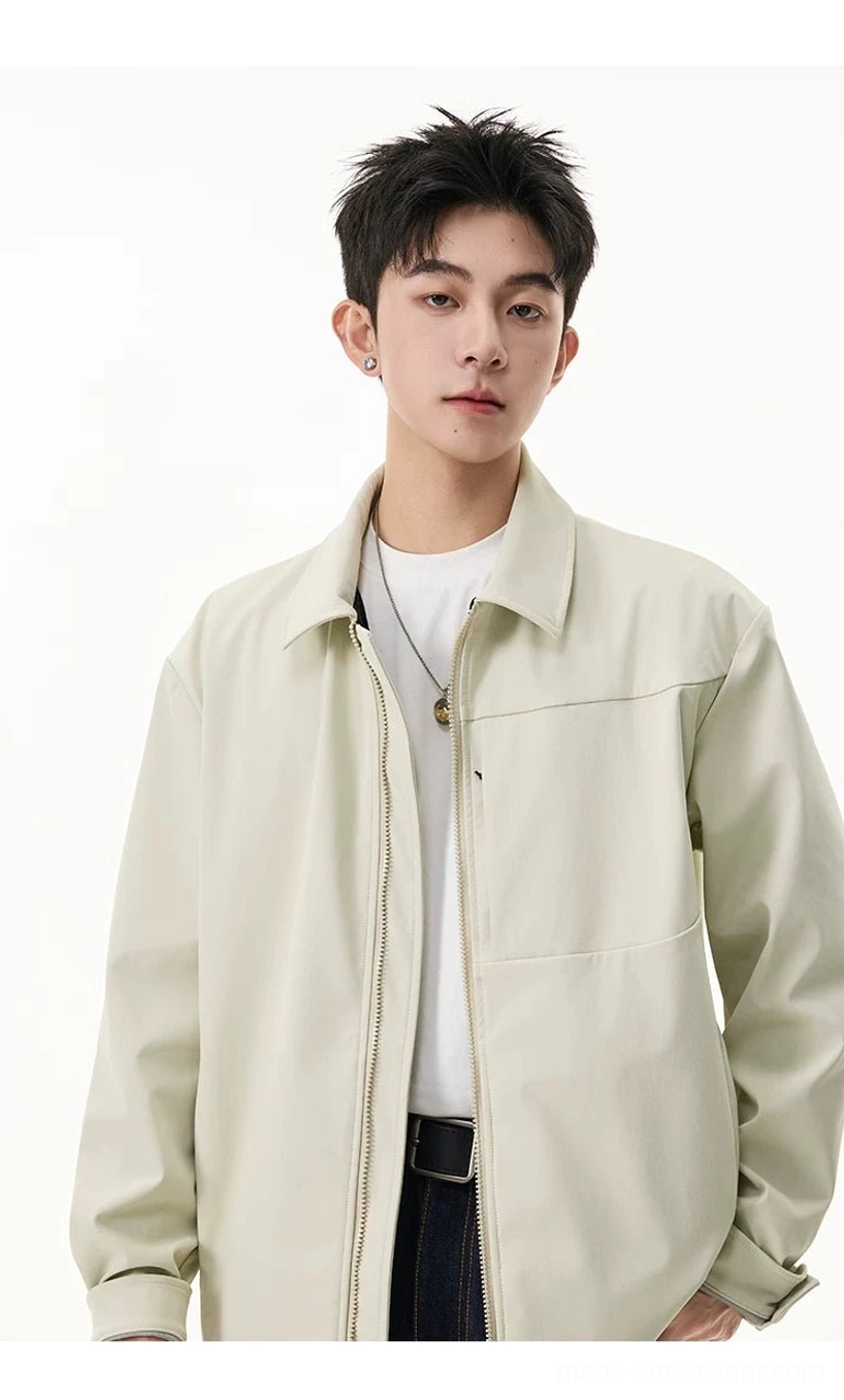 Close-up of pale beige men's zip shirt jacket with structured point collar and full front zipper