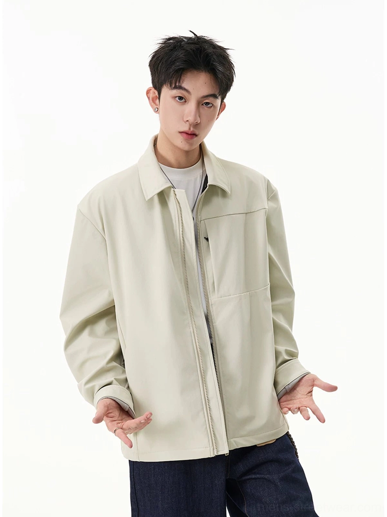 Men's pale beige zip shirt jacket with relaxed silhouette worn over a white tee and dark jeans