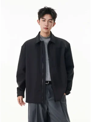 Men's black zip shirt jacket in relaxed Korean streetwear fit styled with a gray top and wide-leg trousers