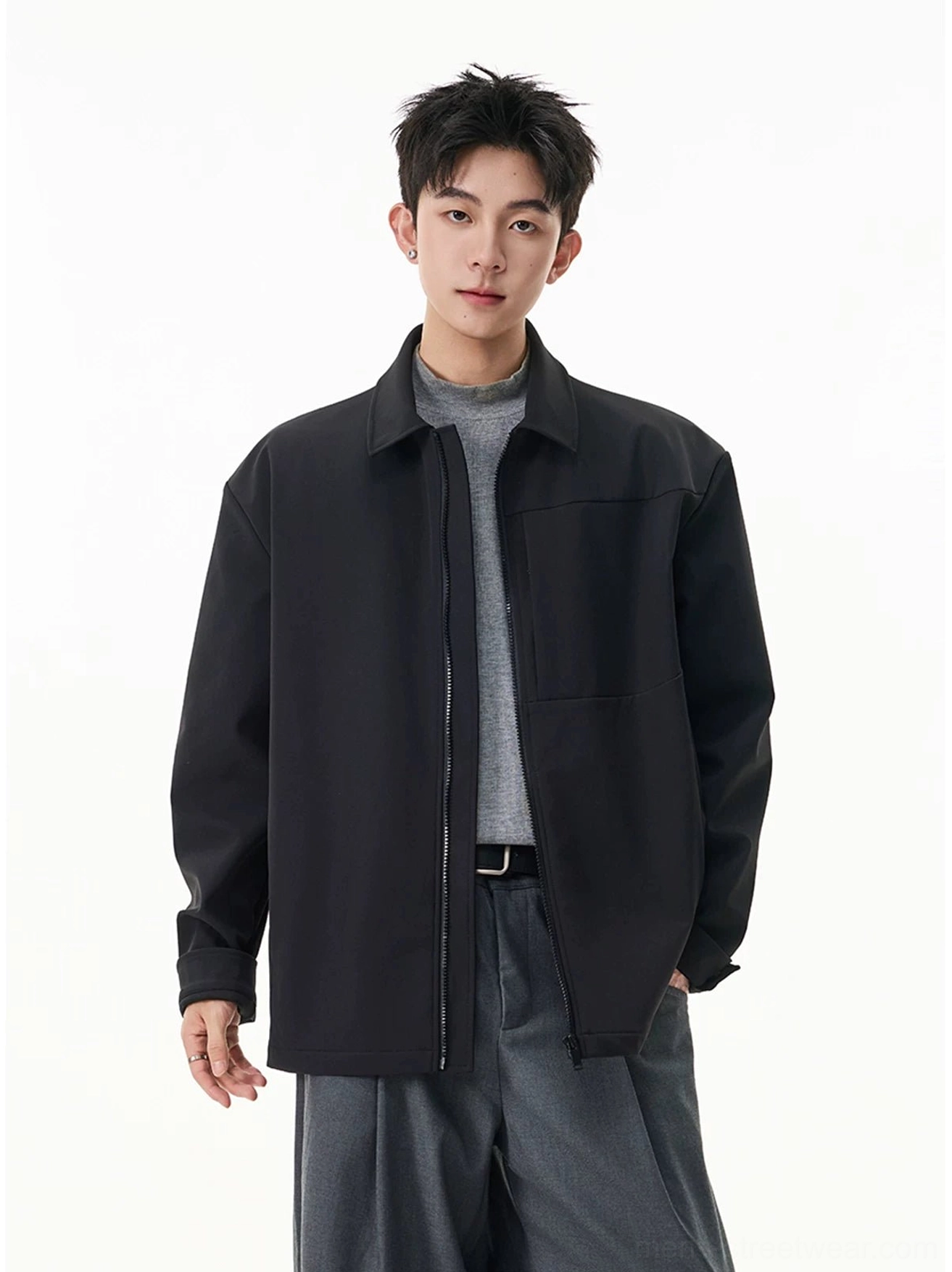 Men's black zip shirt jacket in relaxed Korean streetwear fit styled with a gray top and wide-leg trousers