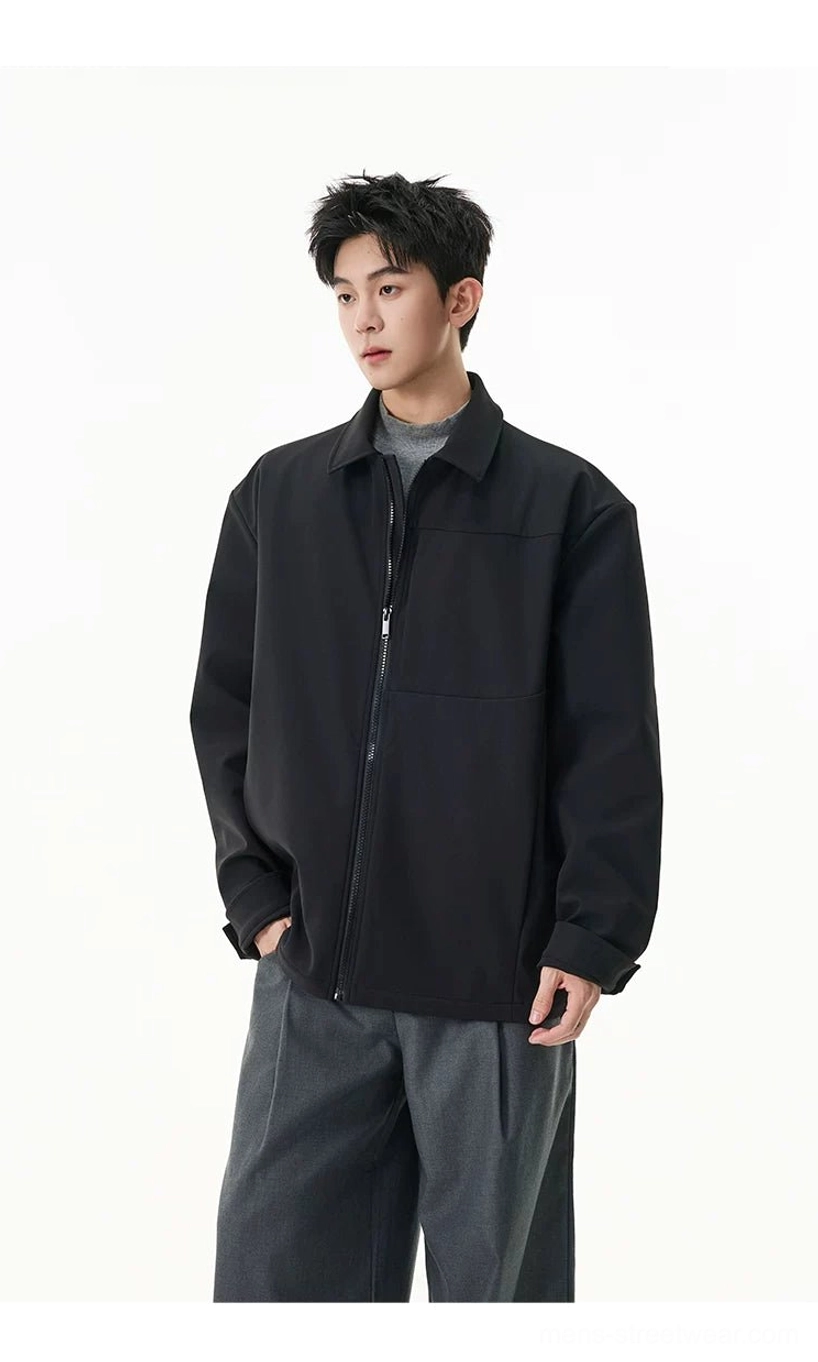 Men's black zip shirt jacket with tailored relaxed fit styled with gray wide-leg trousers