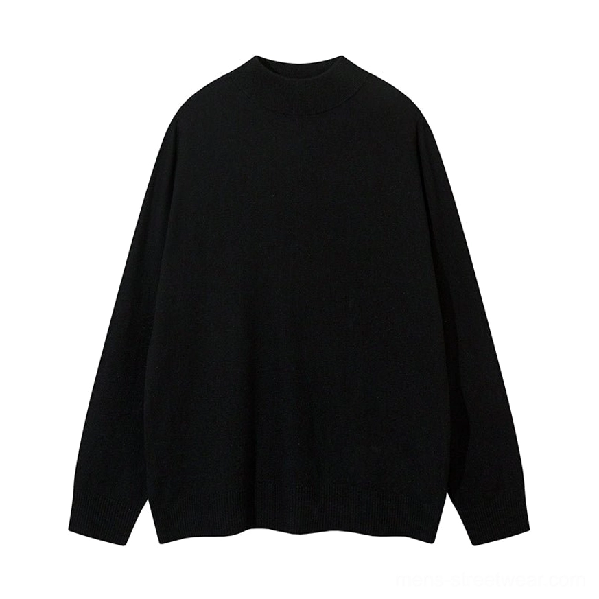 Black minimalist mock neck knit sweater flat lay showing a smooth knit finish ribbed cuffs and ribbed hem