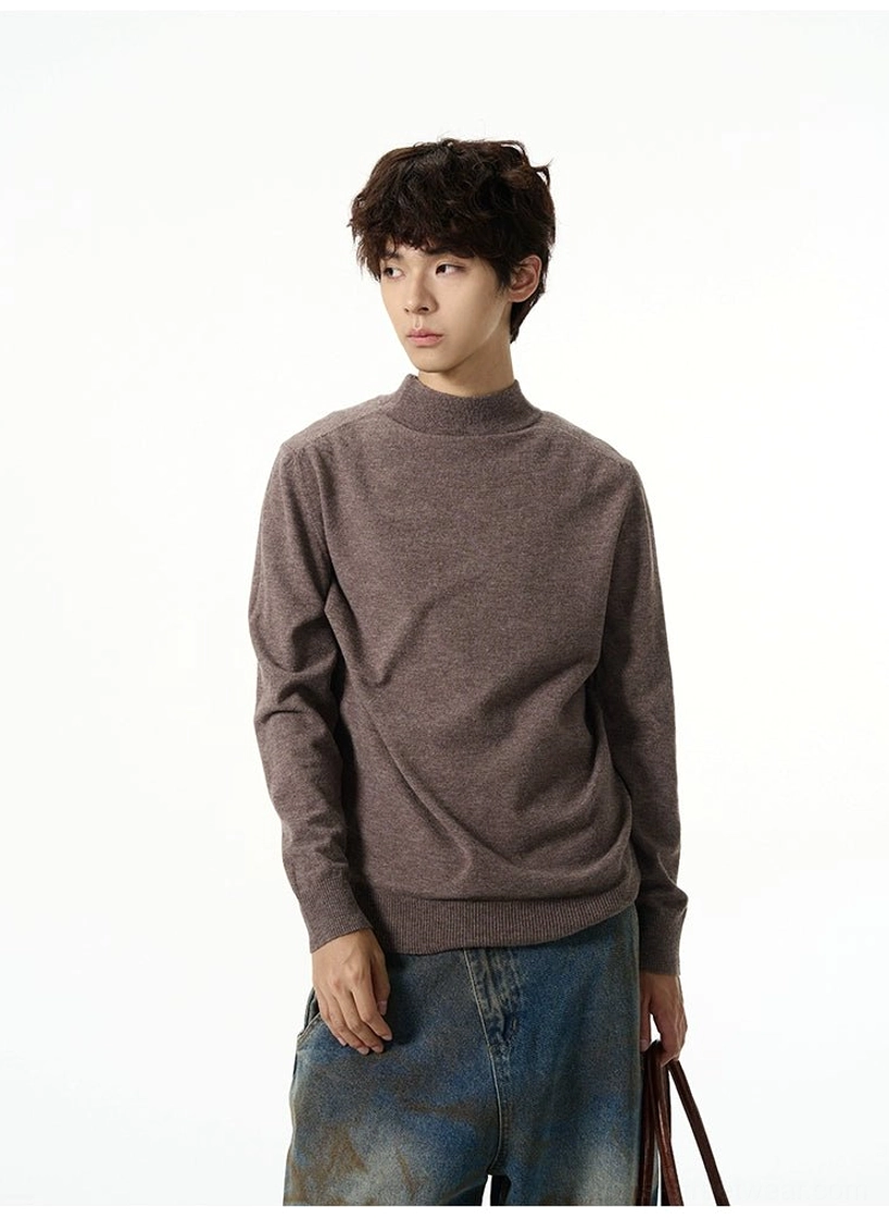 Heather brown minimalist mock neck knit sweater front view with vintage washed denim and leather tote bag