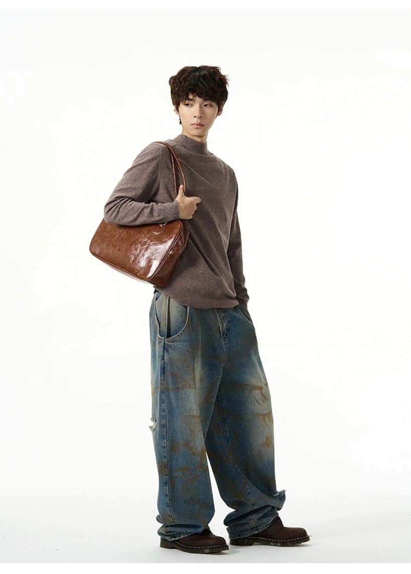 Heather brown mock neck knit sweater side view worn with washed blue jeans and brown shoulder bag