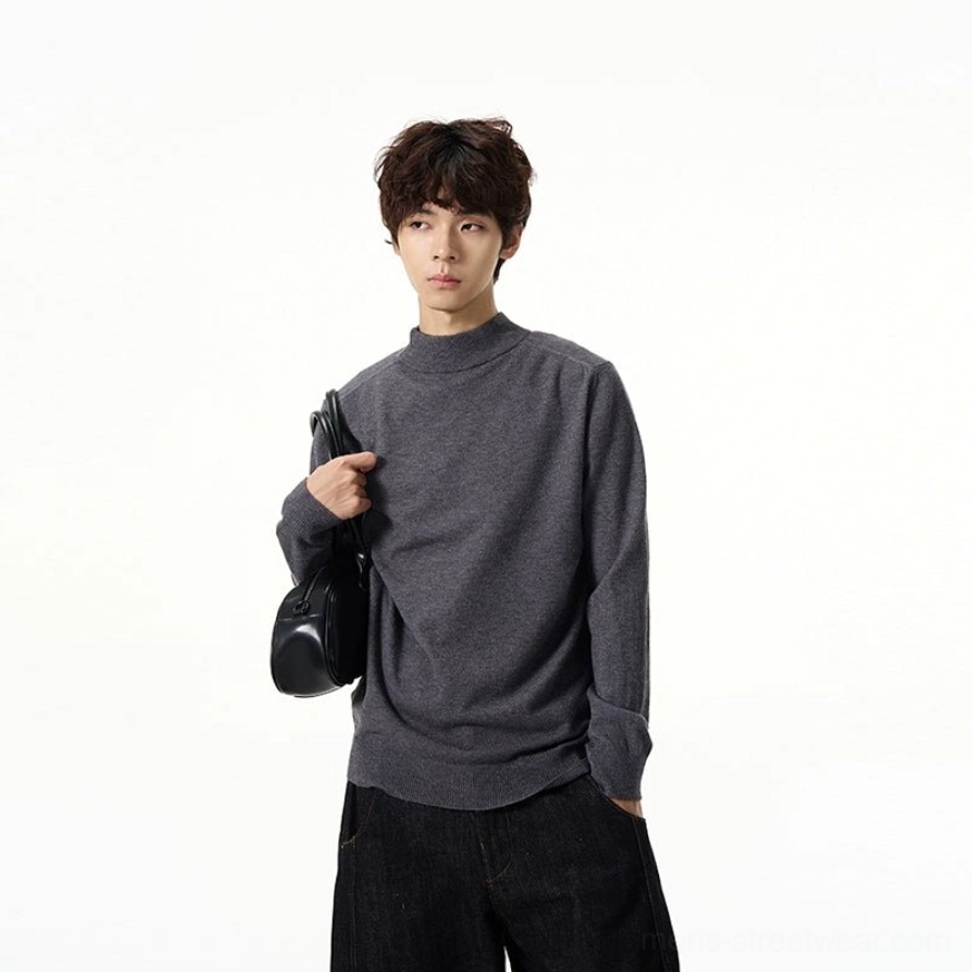 Minimalist mock neck knit sweater showing soft premium knit fabric and long sleeve streetwear silhouette