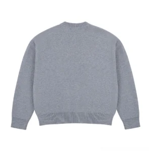 Ash gray minimalist knit cardigan back view with relaxed boxy silhouette and ribbed hem