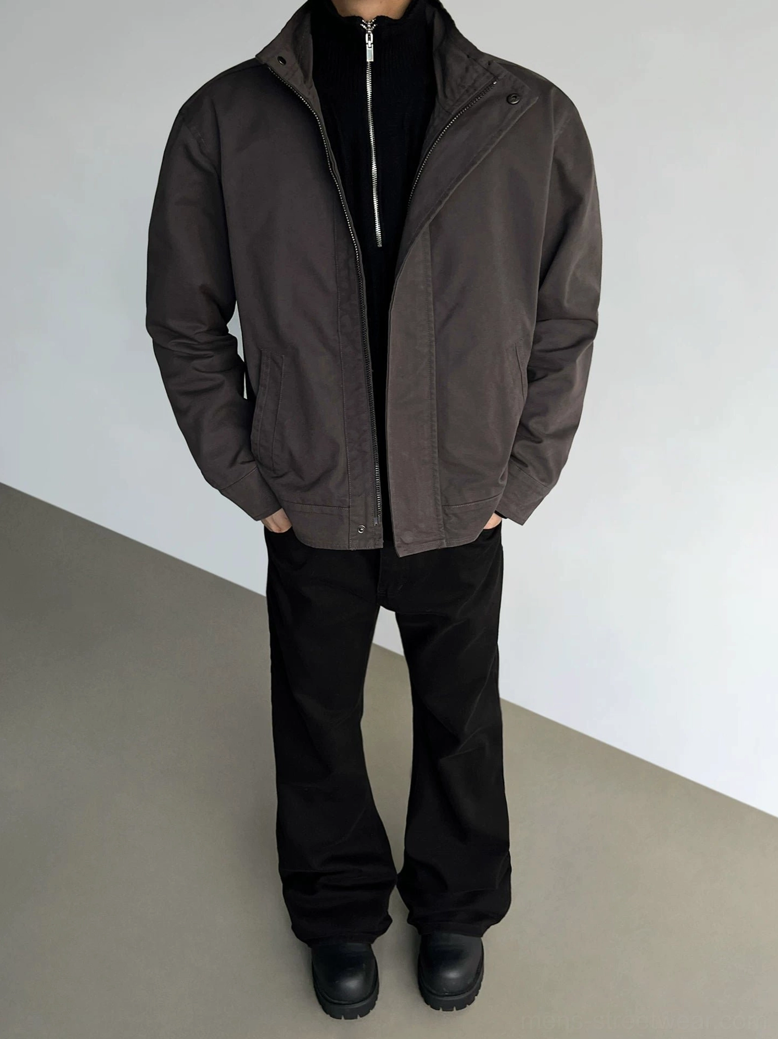 Dark brown stand collar casual jacket styled with black straight trousers and leather shoes in full body studio view