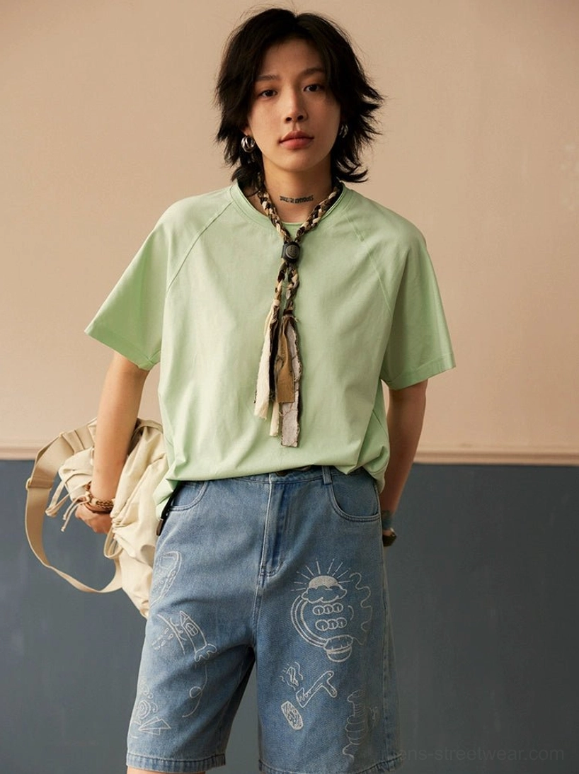 Mint green cotton raglan T-shirt with relaxed fit, muted color palette, and contemporary Seoul streetwear styling