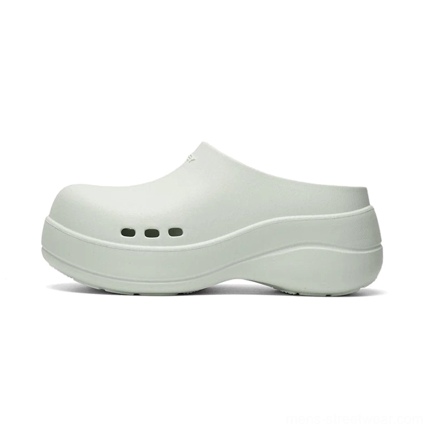 Mint green Midnight Wave platform clogs with sleek slip-on shape, matte finish, closed toe, side ventilation holes and cushioned platform sole