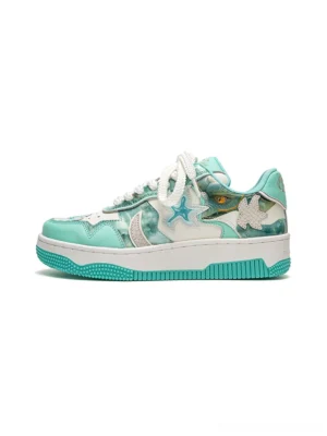 Mint green and white star patch platform skate sneakers shown in a clean side profile with floral appliques and chunky rubber outsole