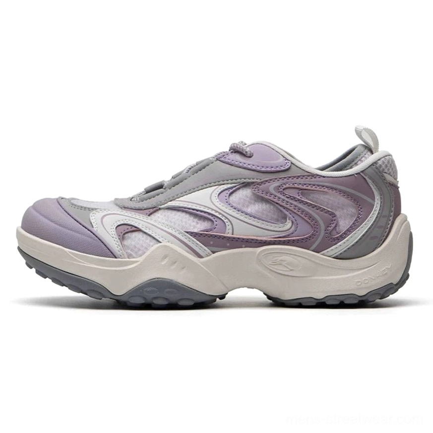 Misty purple and grey streetwear runner sneakers with layered textile overlays, breathable mesh panels, elastic toggle laces, and chunky rubber sole