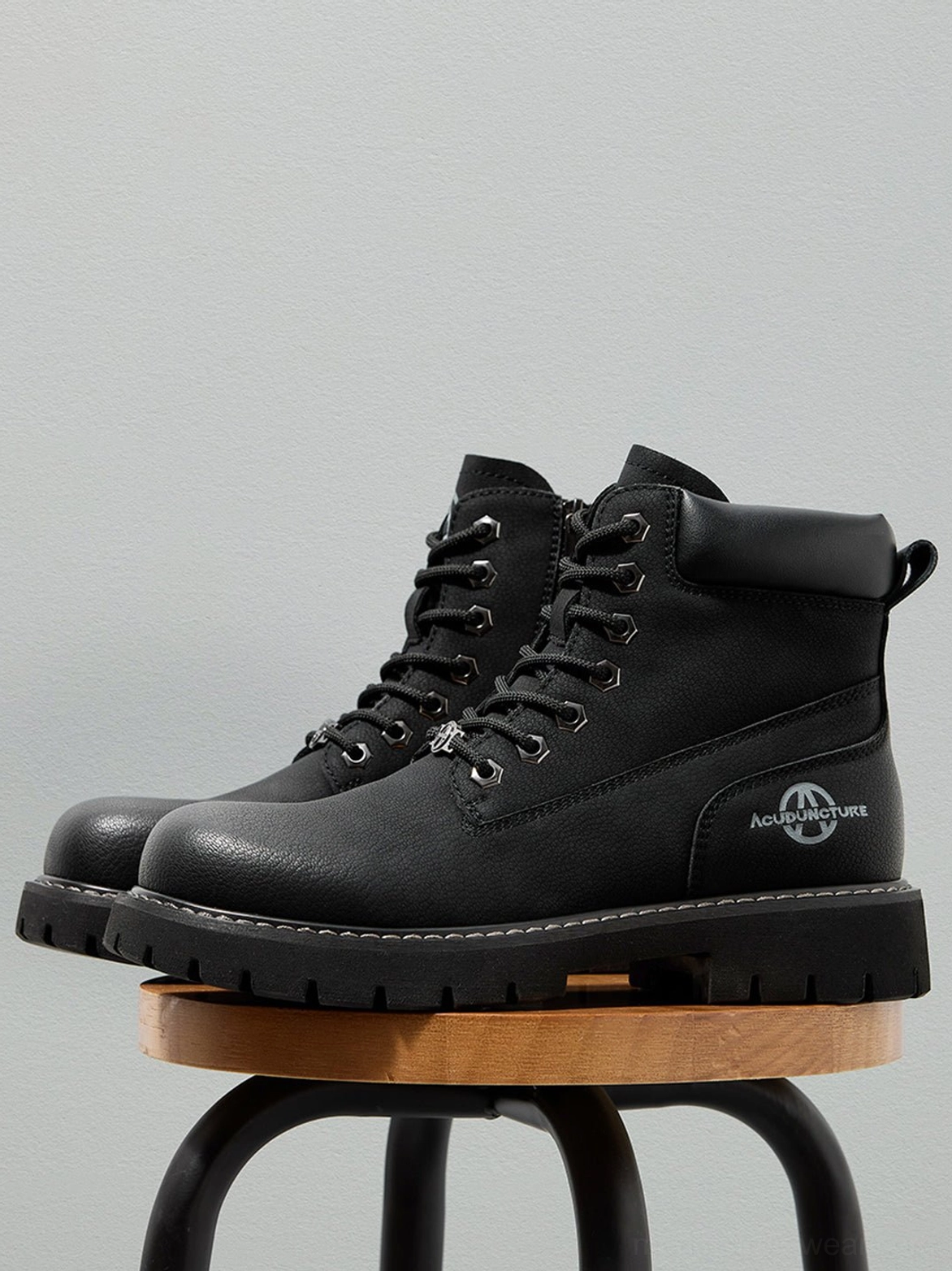 Modern Asian streetwear ankle boots with chunky lug outsole, rounded toe, and practical zip fastening