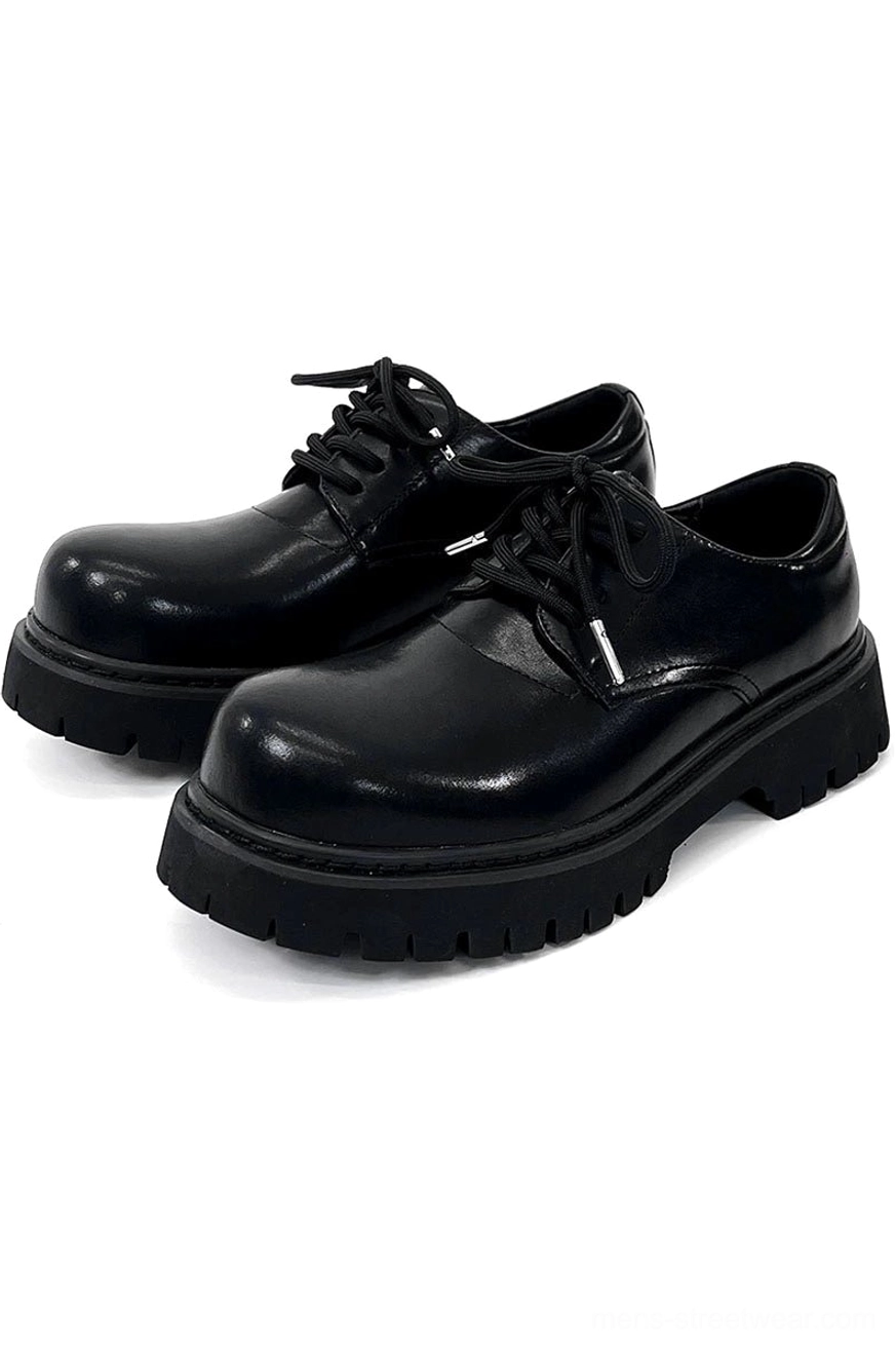 Modern chunky black derby shoes with architectural proportions for avant-garde streetwear styling