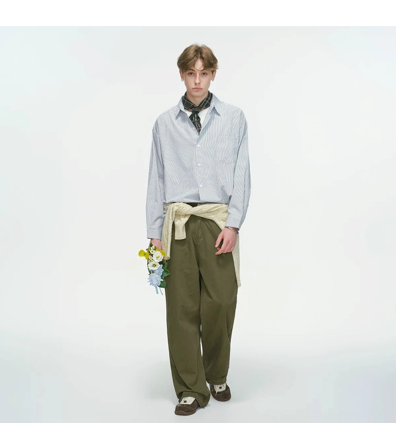 Modern East Asian streetwear overshirt featuring fine vertical stripes, loose shoulders, long sleeves, and relaxed proportions