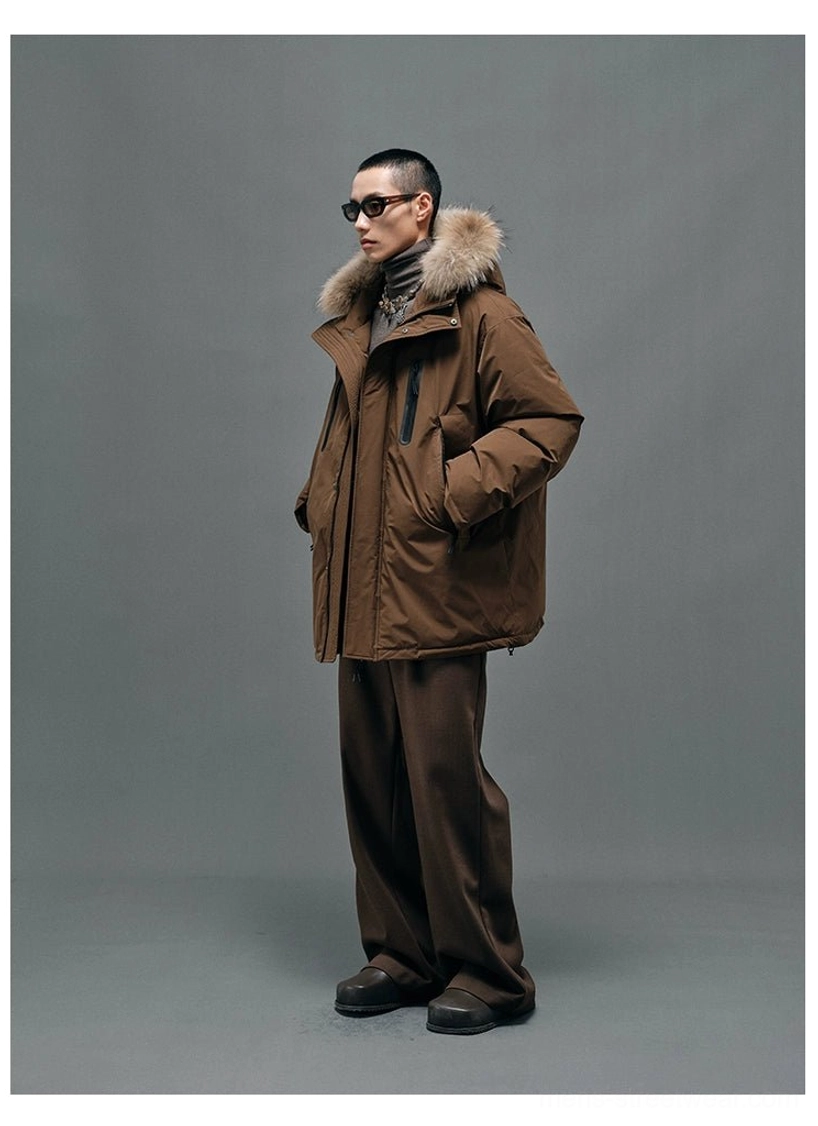 Modern hooded down winter coat with detachable raccoon fur collar, roomy A-line silhouette and utility pocket styling