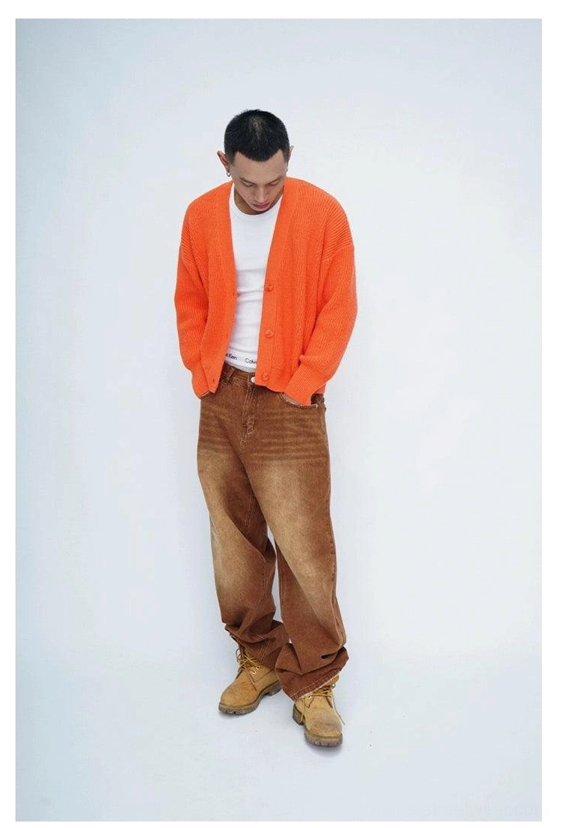 Modern Korean style fuzzy cardigan with oversized proportions, ribbed knit texture, button front, and statement back design