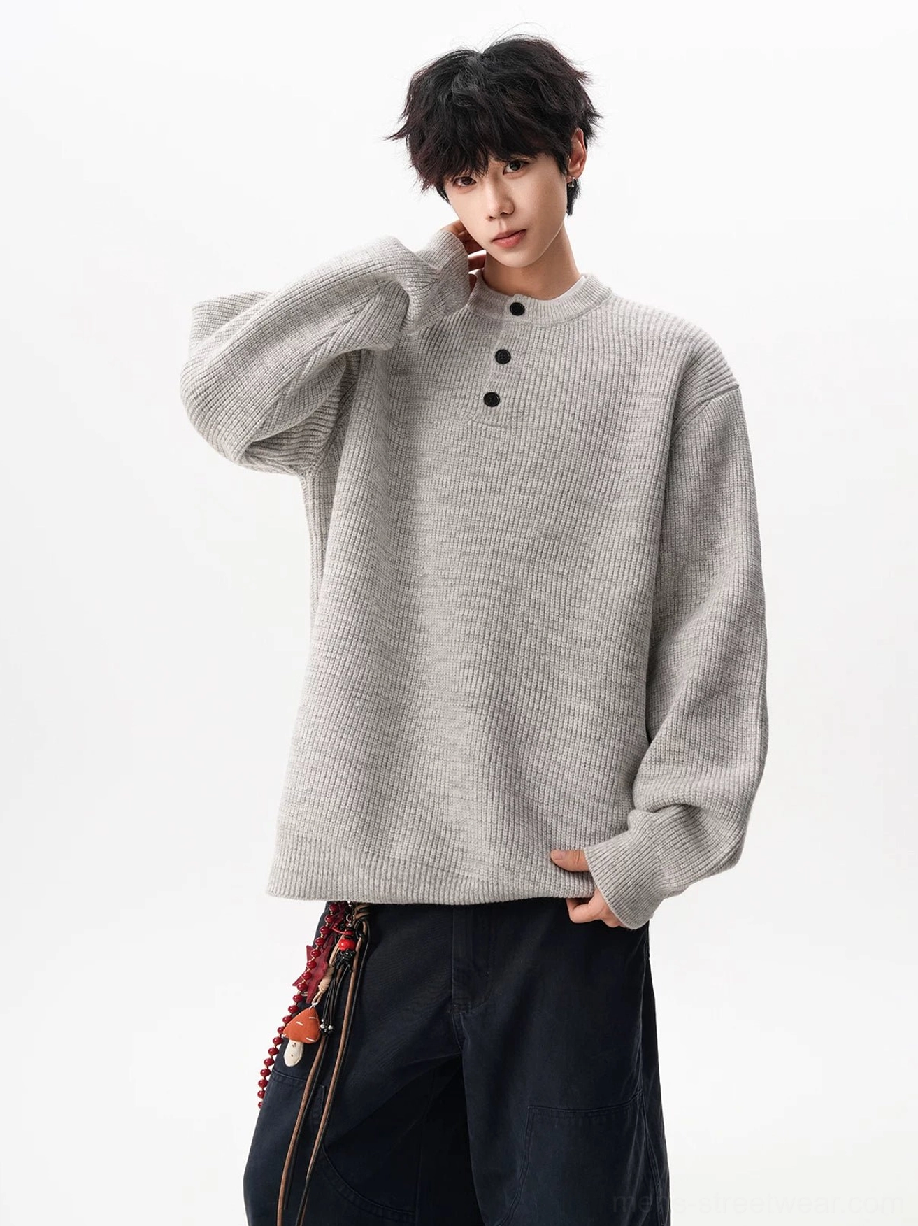 Modern Korean style oversized waffle sweater with relaxed body, button neckline, and versatile neutral styling