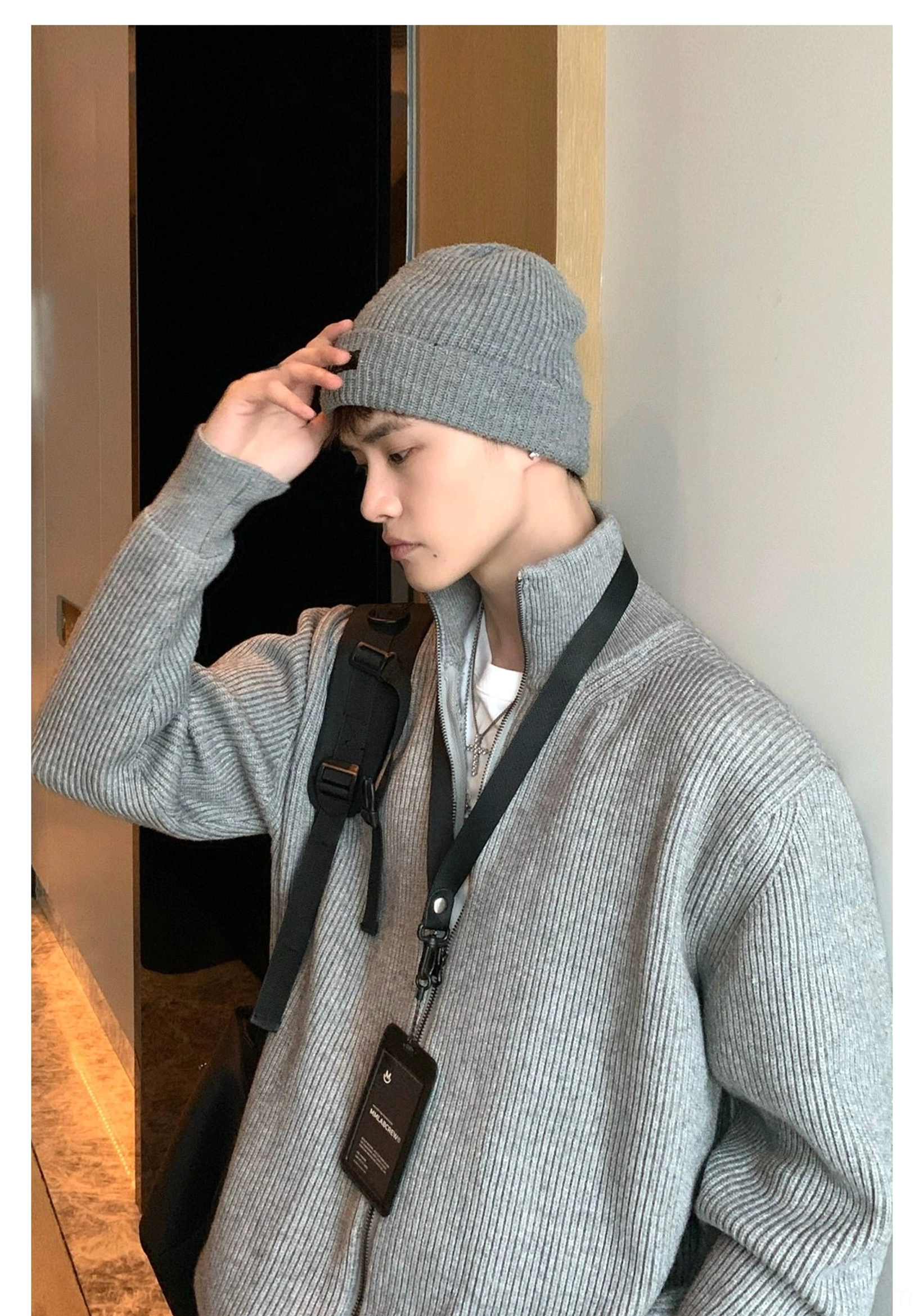 Modern men's streetwear cardigan with vertical ribbed texture, adjustable double zipper, and comfortable relaxed proportions