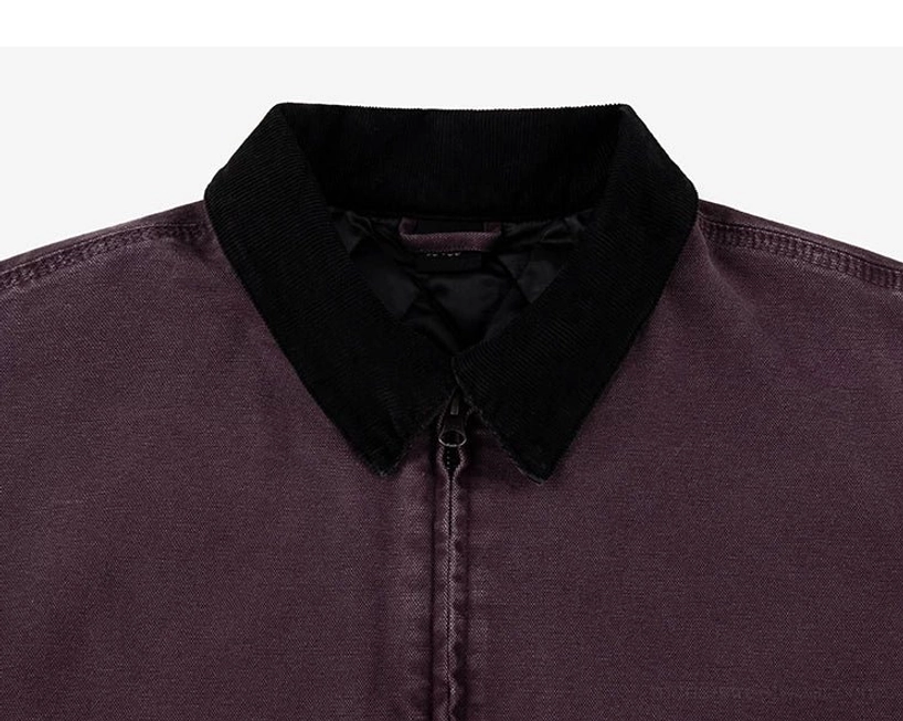 Modern workwear jacket with relaxed fit, curved split hem, oversized pockets, and durable cotton canvas construction
