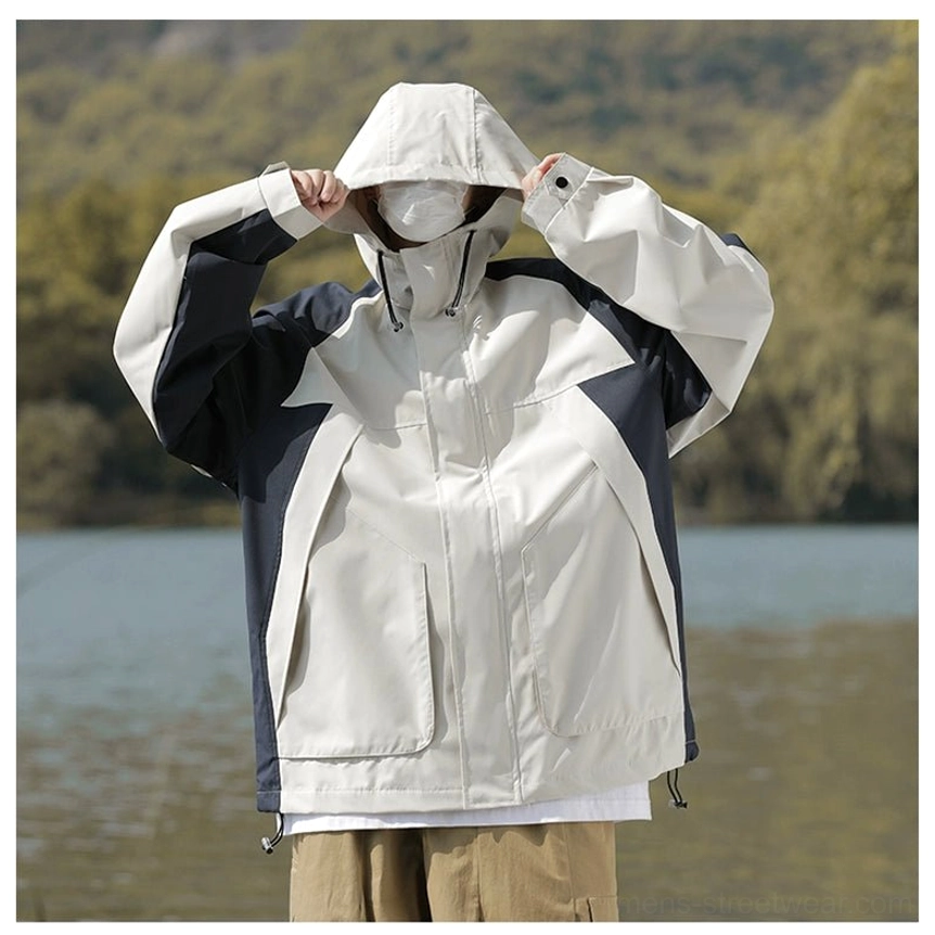 Modern techwear-inspired colorblock jacket with hood, zipper closure, and front flap pockets