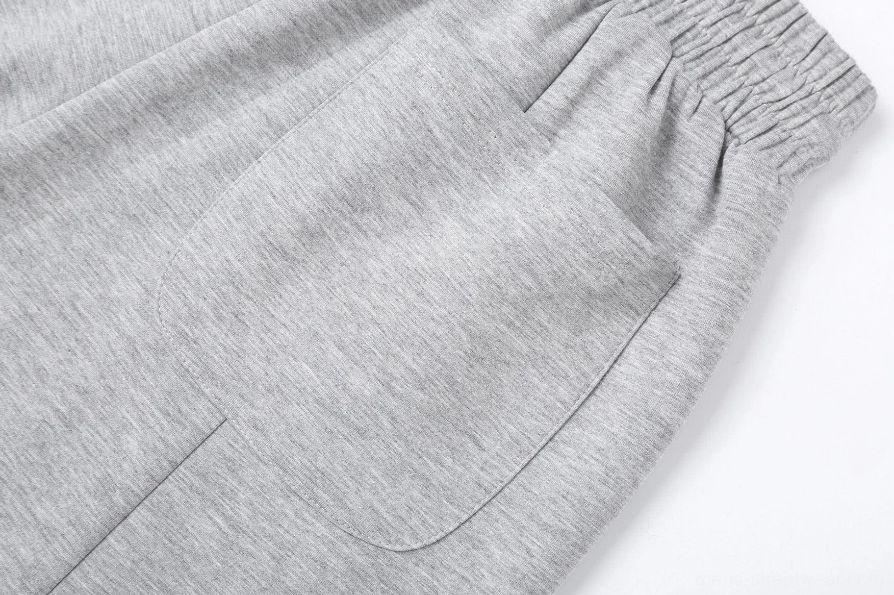 Modern wide-leg sweatpants with soft drape, adjustable waistband, and contemporary Korean streetwear aesthetic