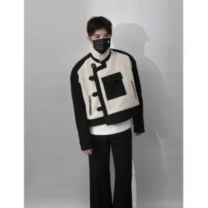 Front view of male model in monochrome cropped sherpa streetwear jacket featuring black utility pockets and exposed zipper details
