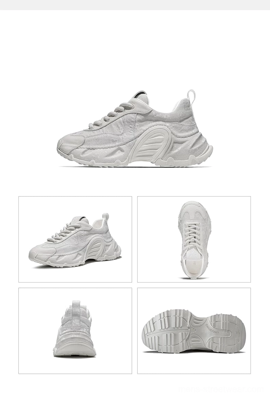 Top view of beige monogram drift chunky sneakers showing leather toe cap laces and cushioned inner lining