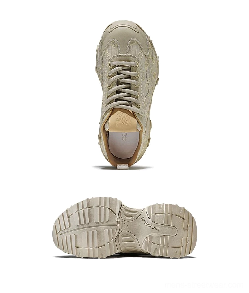 Rear side view of beige monogram drift chunky sneakers showing tan heel collar pull tab and thick sole