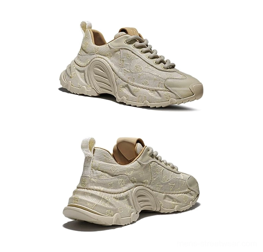 Beige monogram drift chunky sneakers in three-quarter front view with textured woven upper and lace-up closure