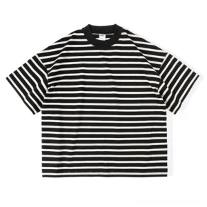 Front flat lay of a black and almond striped boxy T-shirt with relaxed oversized fit, dropped shoulders, wide short sleeves, and ribbed crew neckline