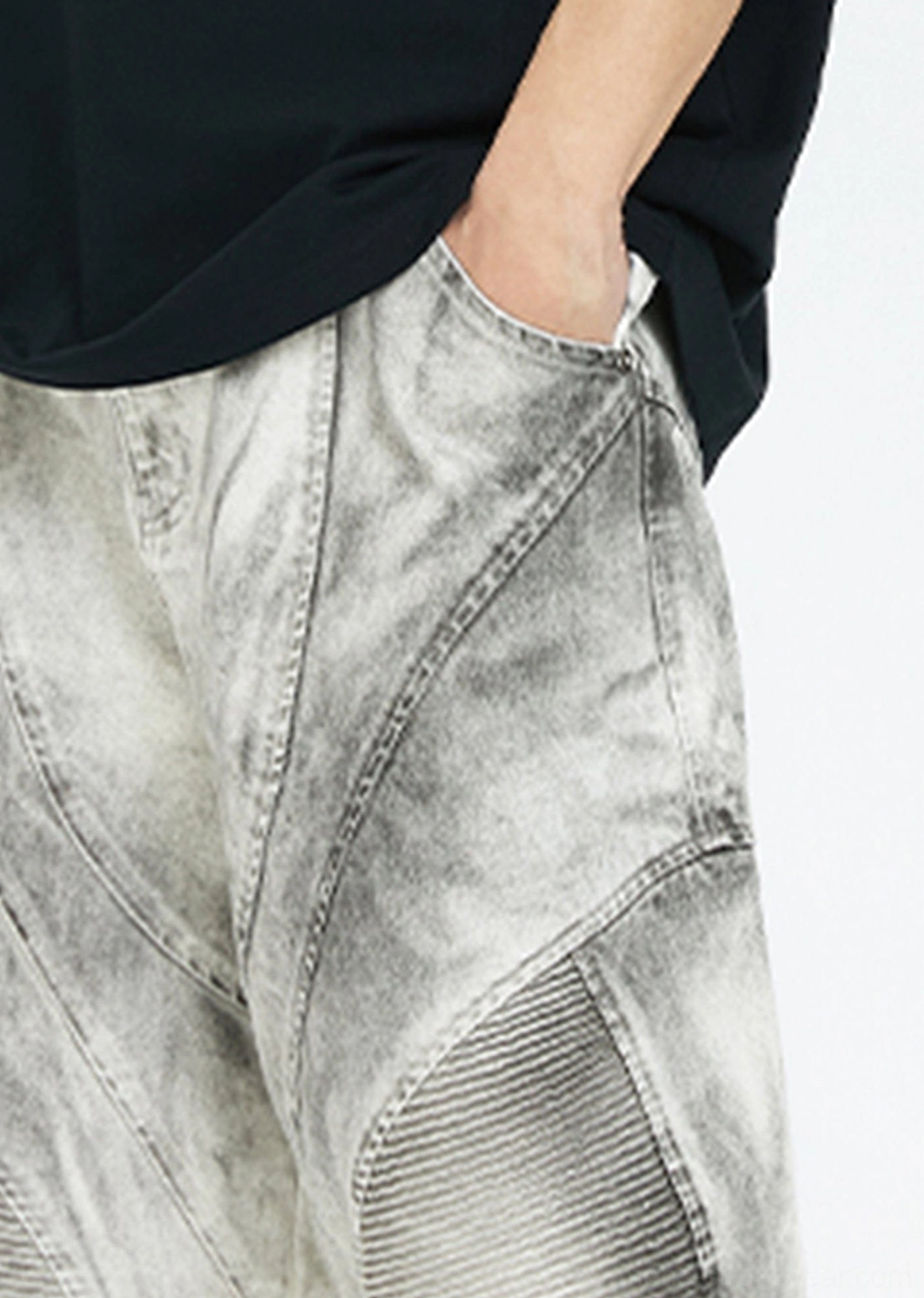 Close up of the moto convertible cargo pants waistband with belt loops, denim style construction, topstitching, and faded fabric