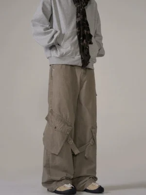 Desert gray multi-strap wide-leg cargo pants with oversized side pockets and relaxed techwear streetwear fit