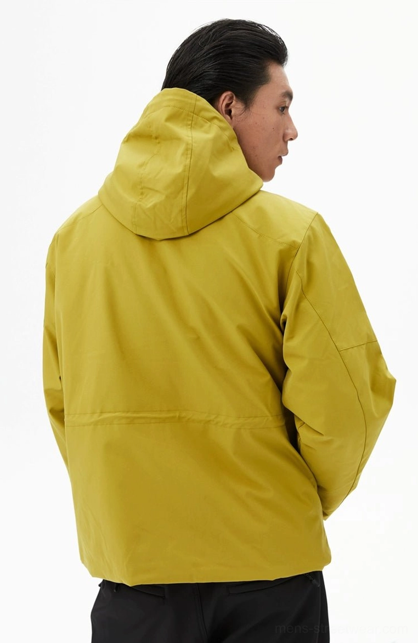 Rear view of a mustard yellow outdoor hooded jacket displaying its clean back panel and relaxed streetwear shape
