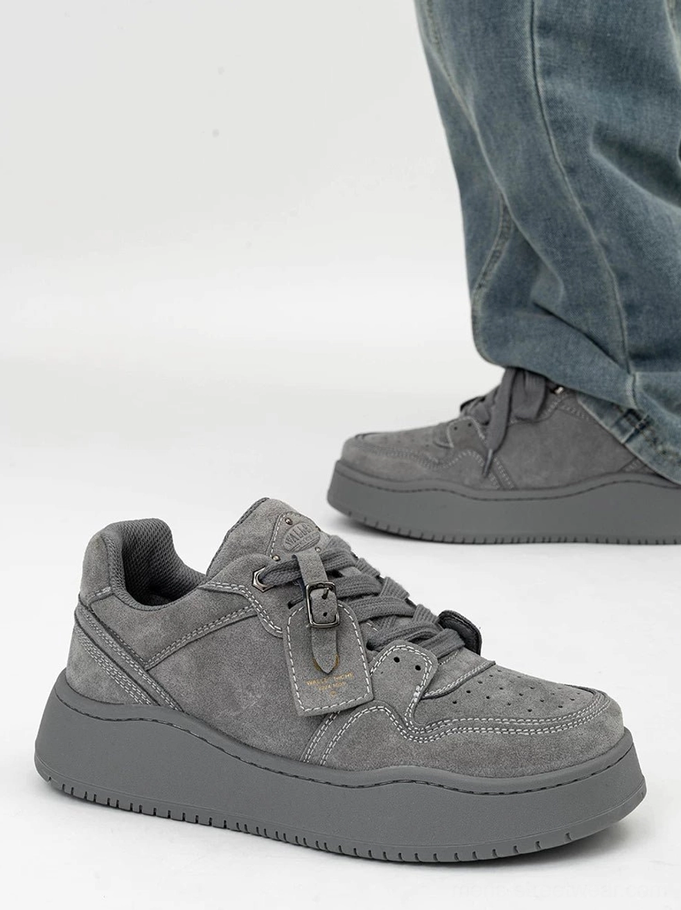 Muted grey suede platform skate sneakers displayed from the front three-quarter angle with lace-up closure and tonal thick rubber soles