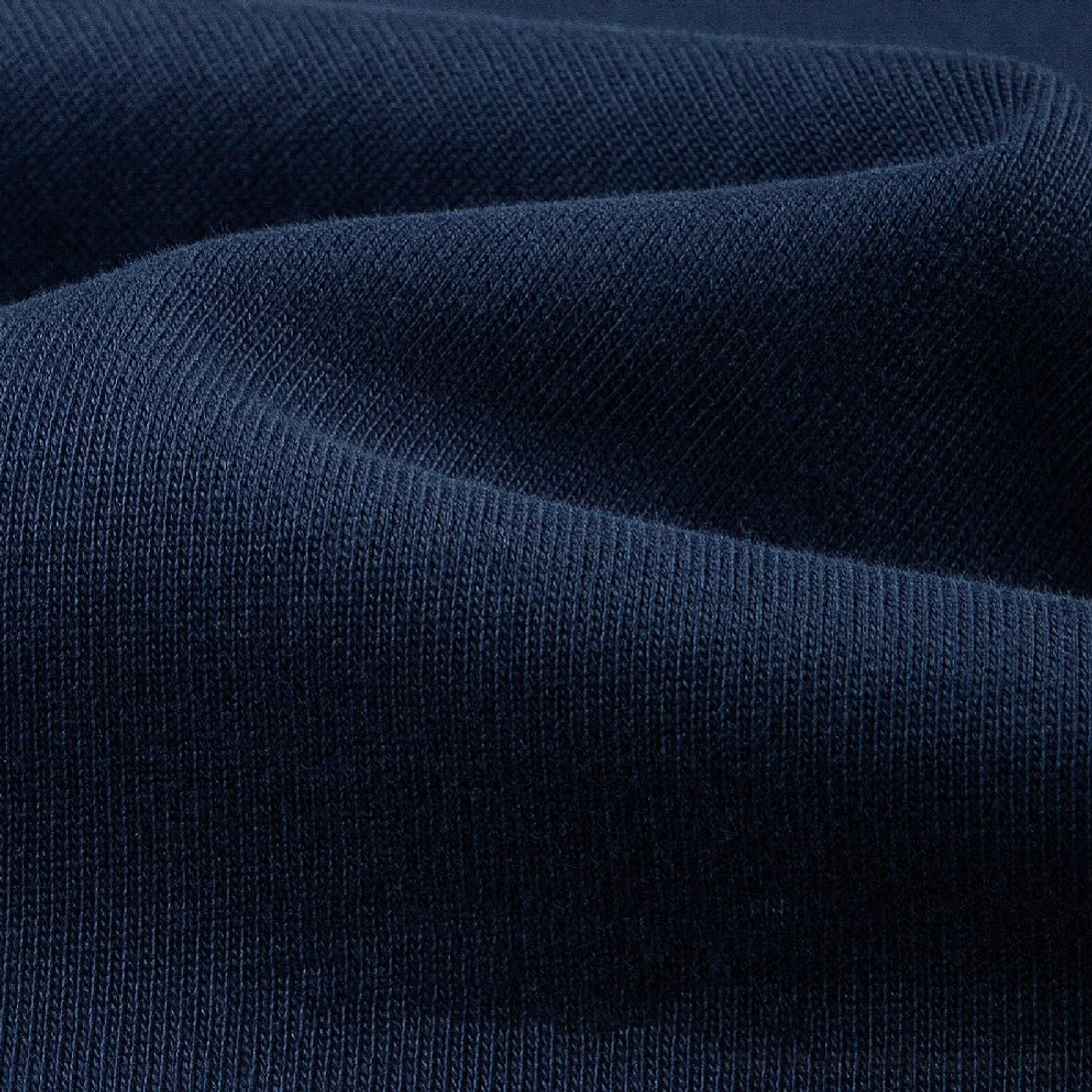 Close-up navy blue 320G heavyweight cotton knit texture for oversized Henley t-shirt