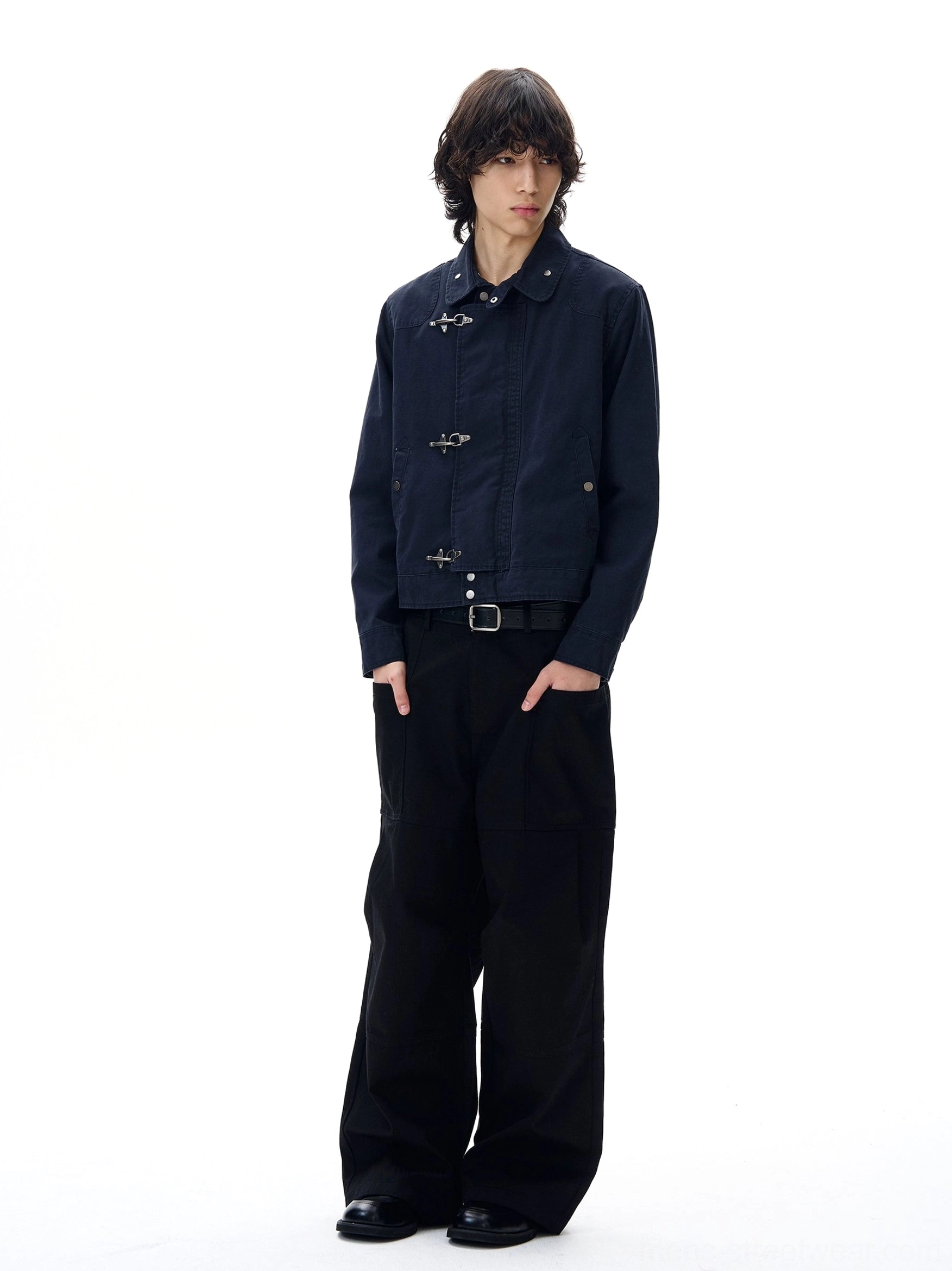 Navy blue cropped workwear utility jacket side back view showing clean tailored silhouette and waist belt