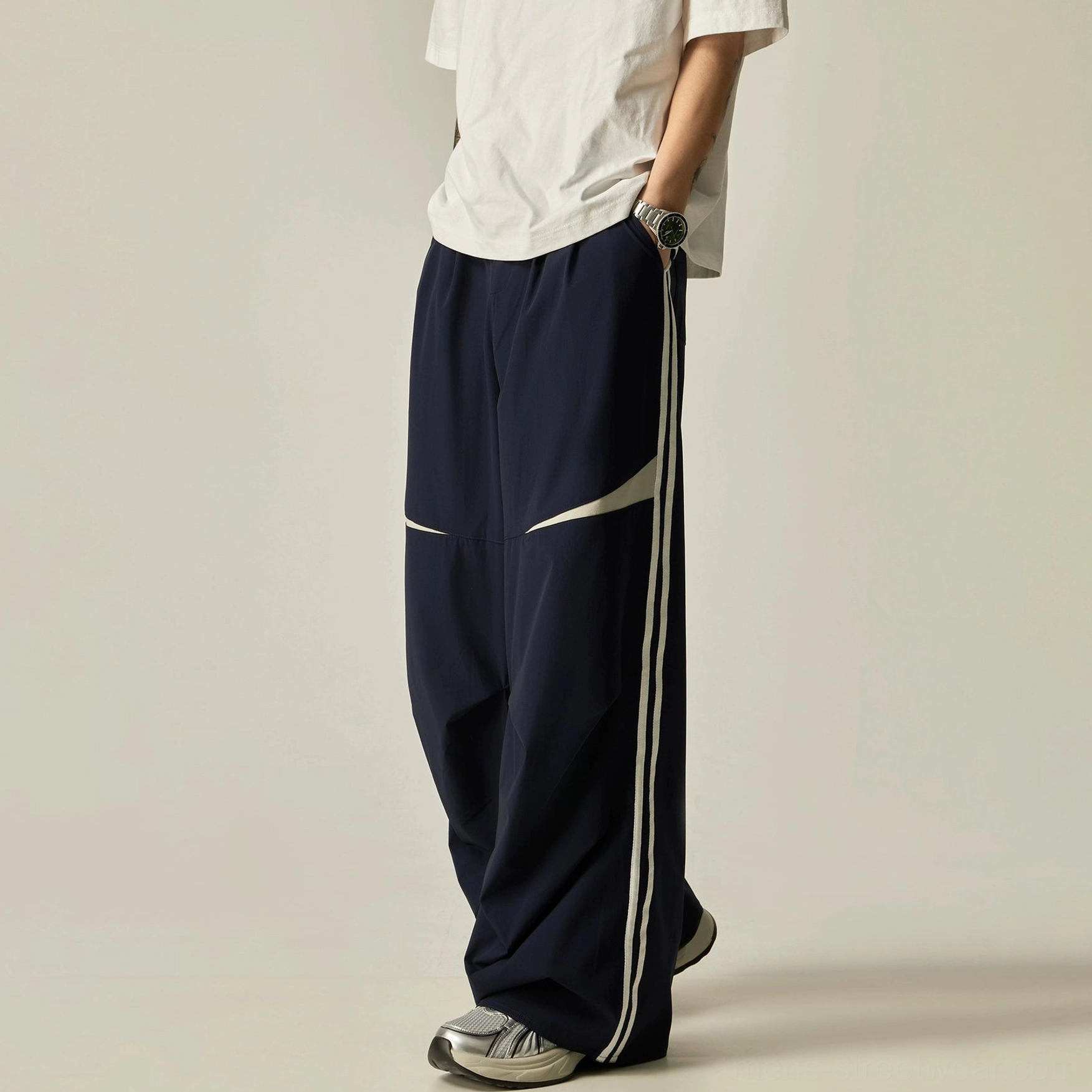 Navy blue dual-stripe wide-leg track pants product image with contrast panels and relaxed Seoul streetwear design
