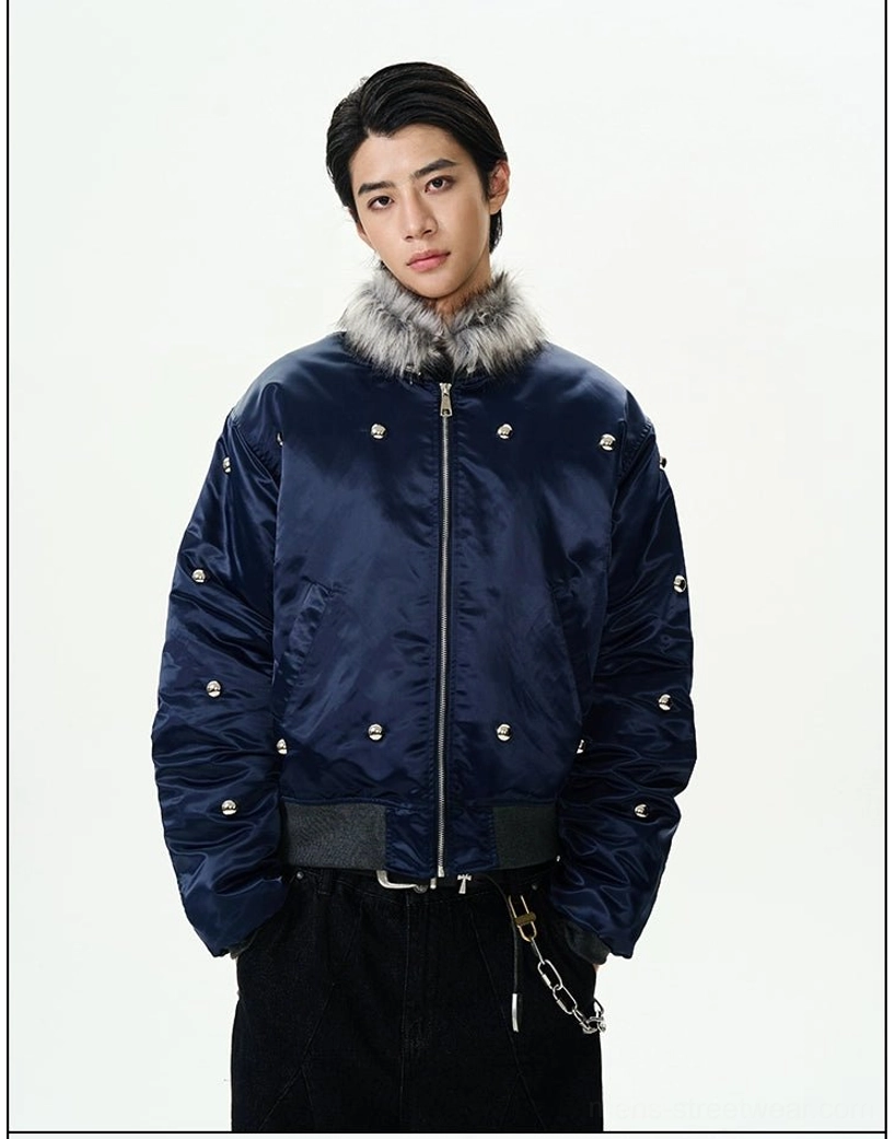 Straight-on view of a navy blue faux fur collar bomber jacket with full front zipper and silver metallic studs